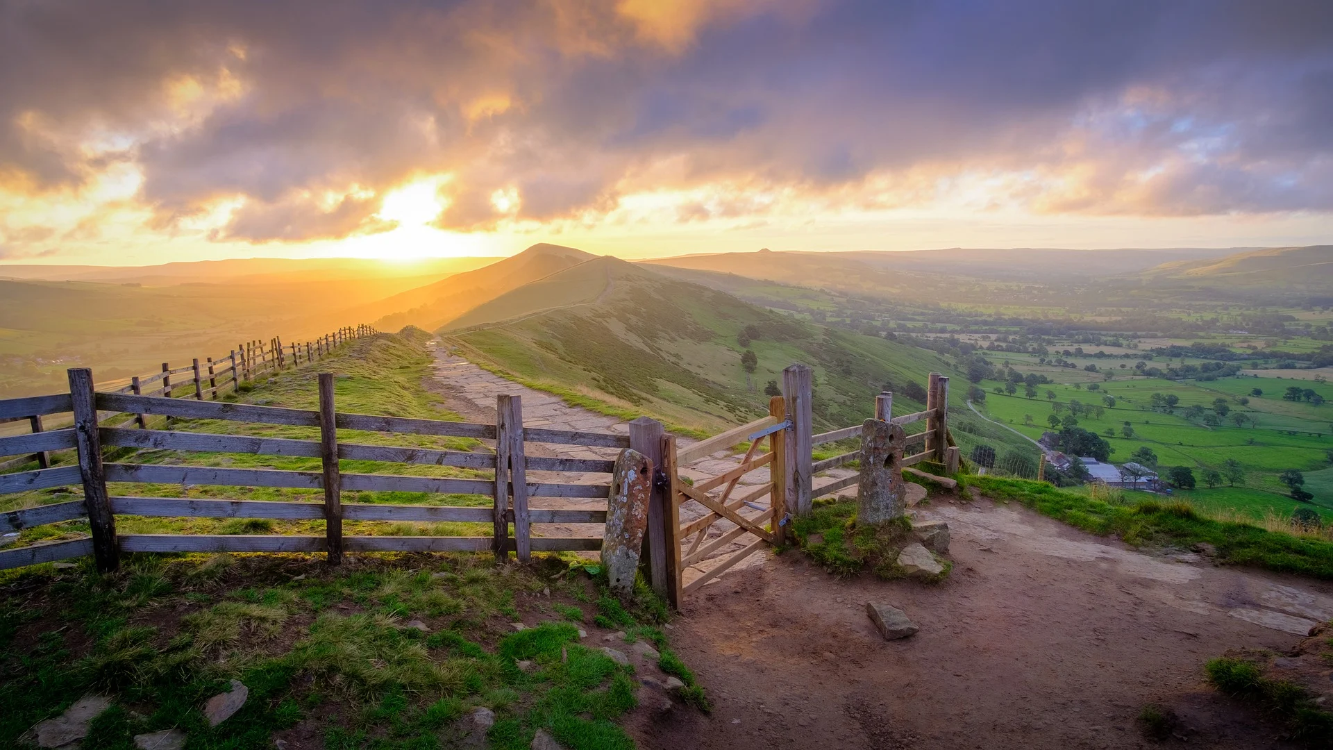 Mam Tor walk with gate and sunset in background