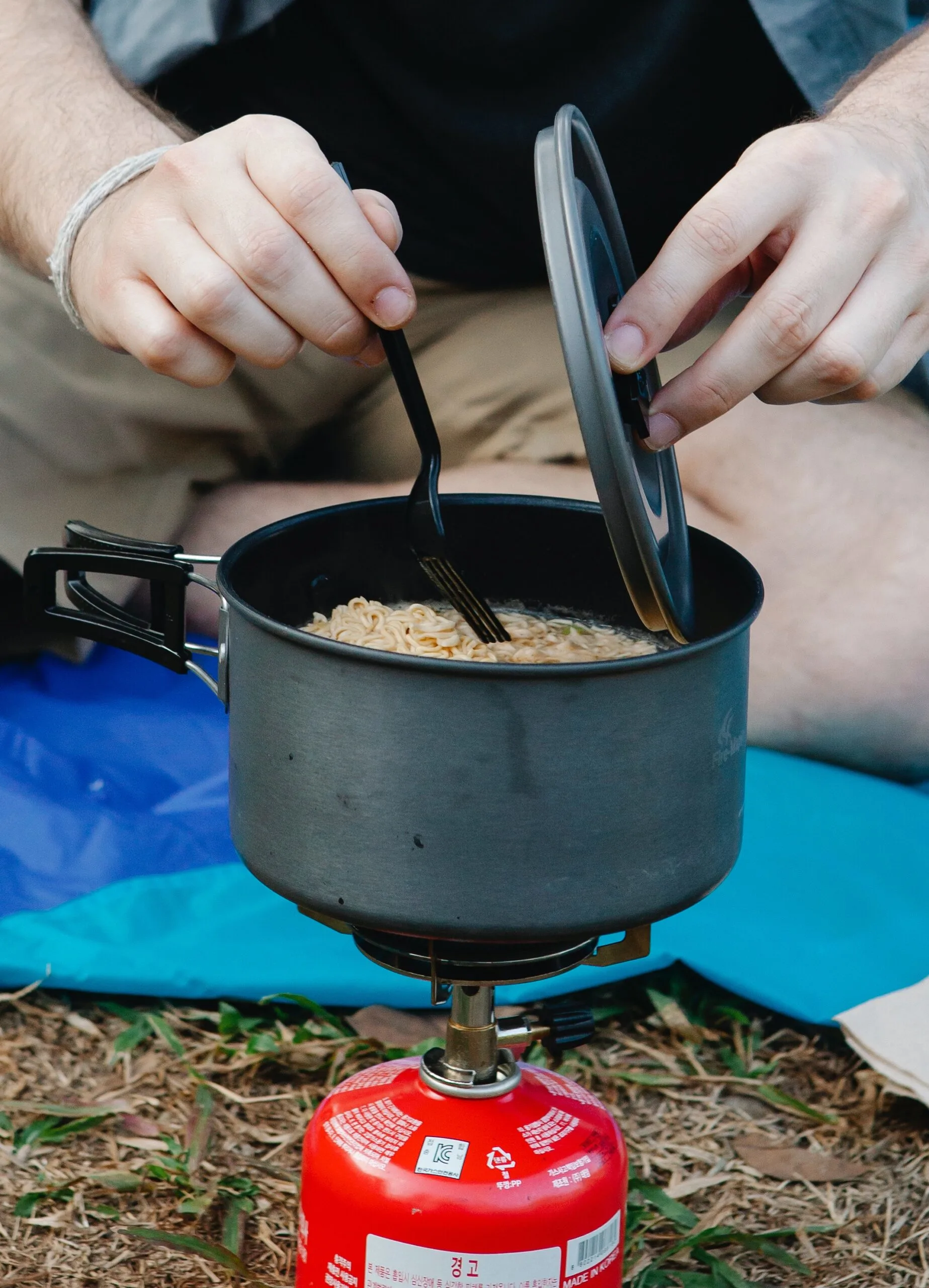 Man cooking on camping stove