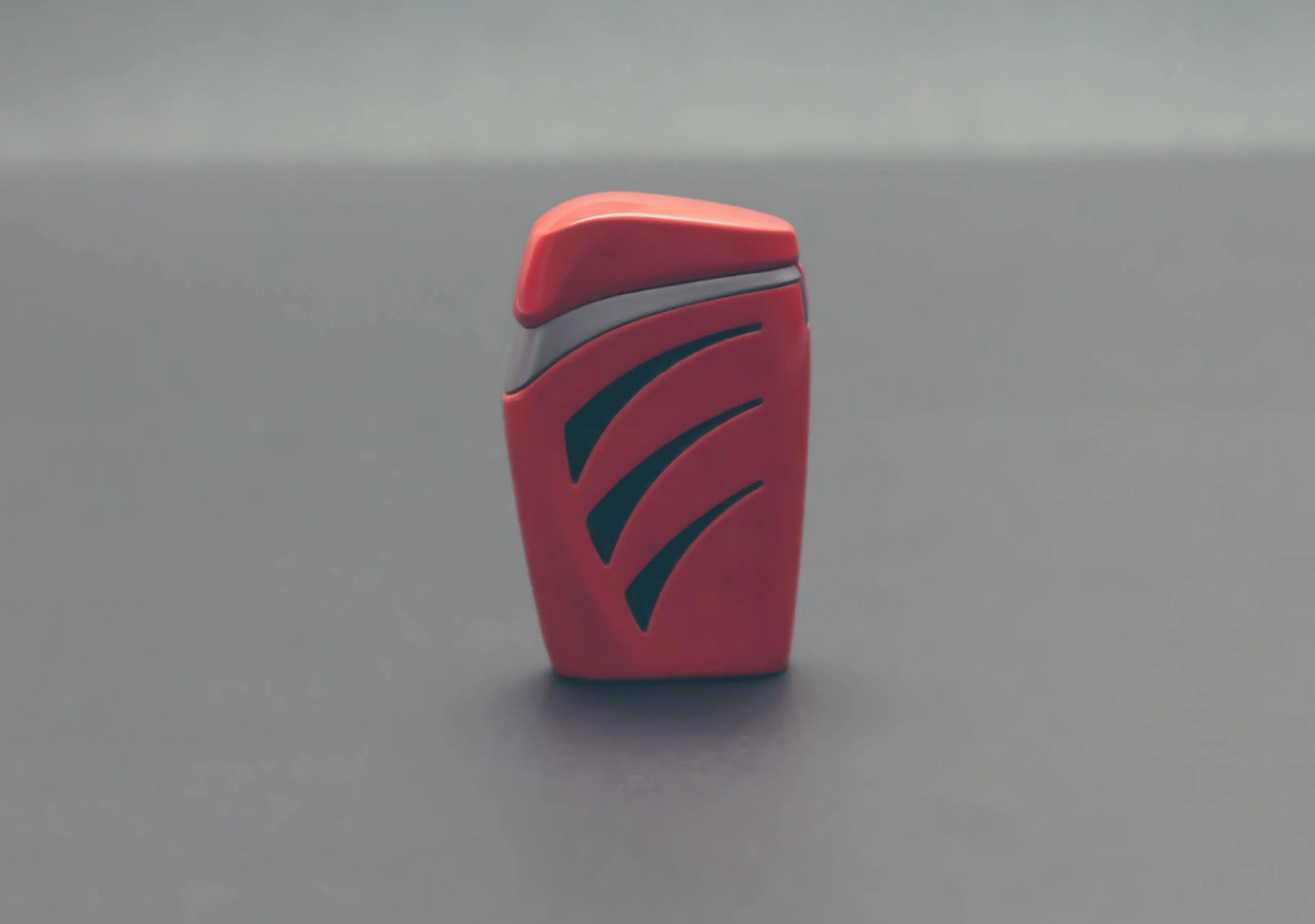 Close-up of Red lighter over White Background