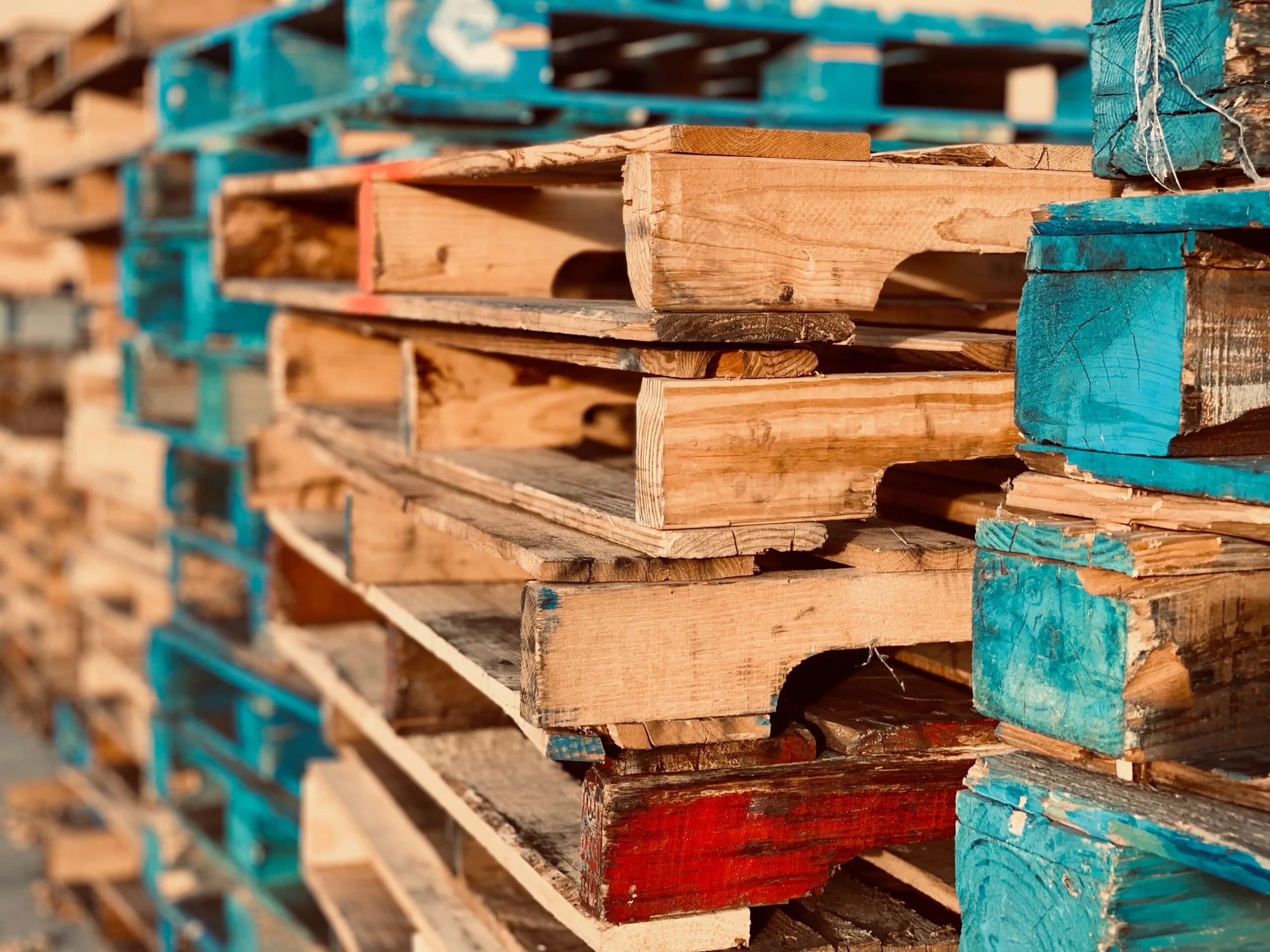 wooden pallets stacked up